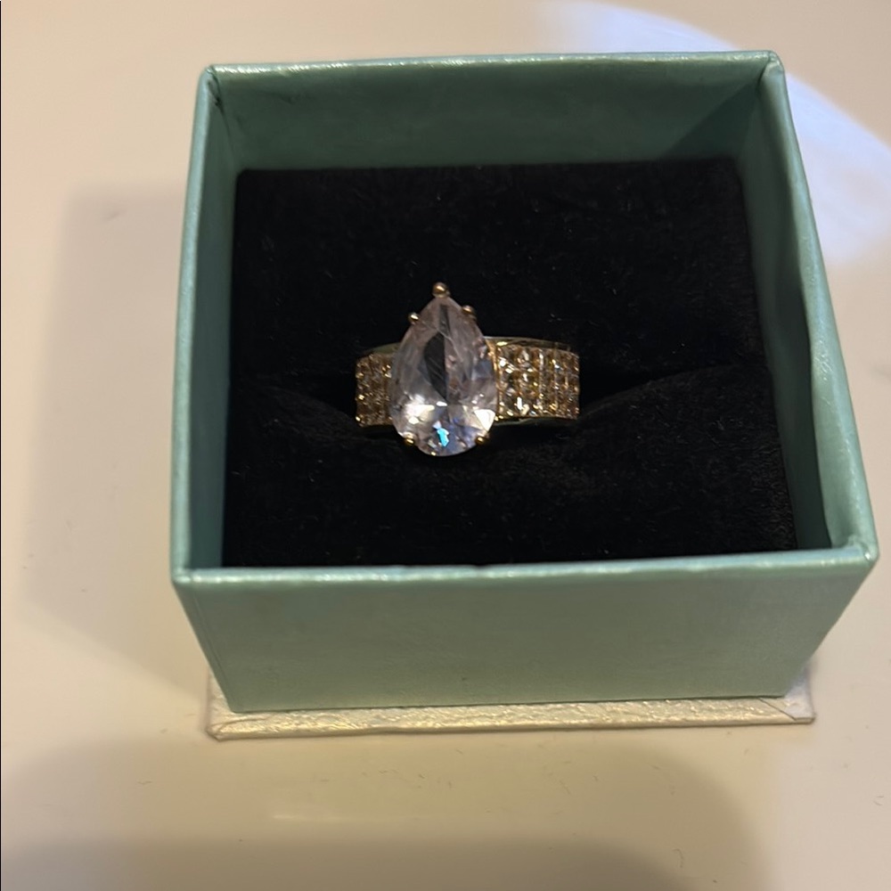 Silver and White Ring with Clear Gemstone and Prong Setting